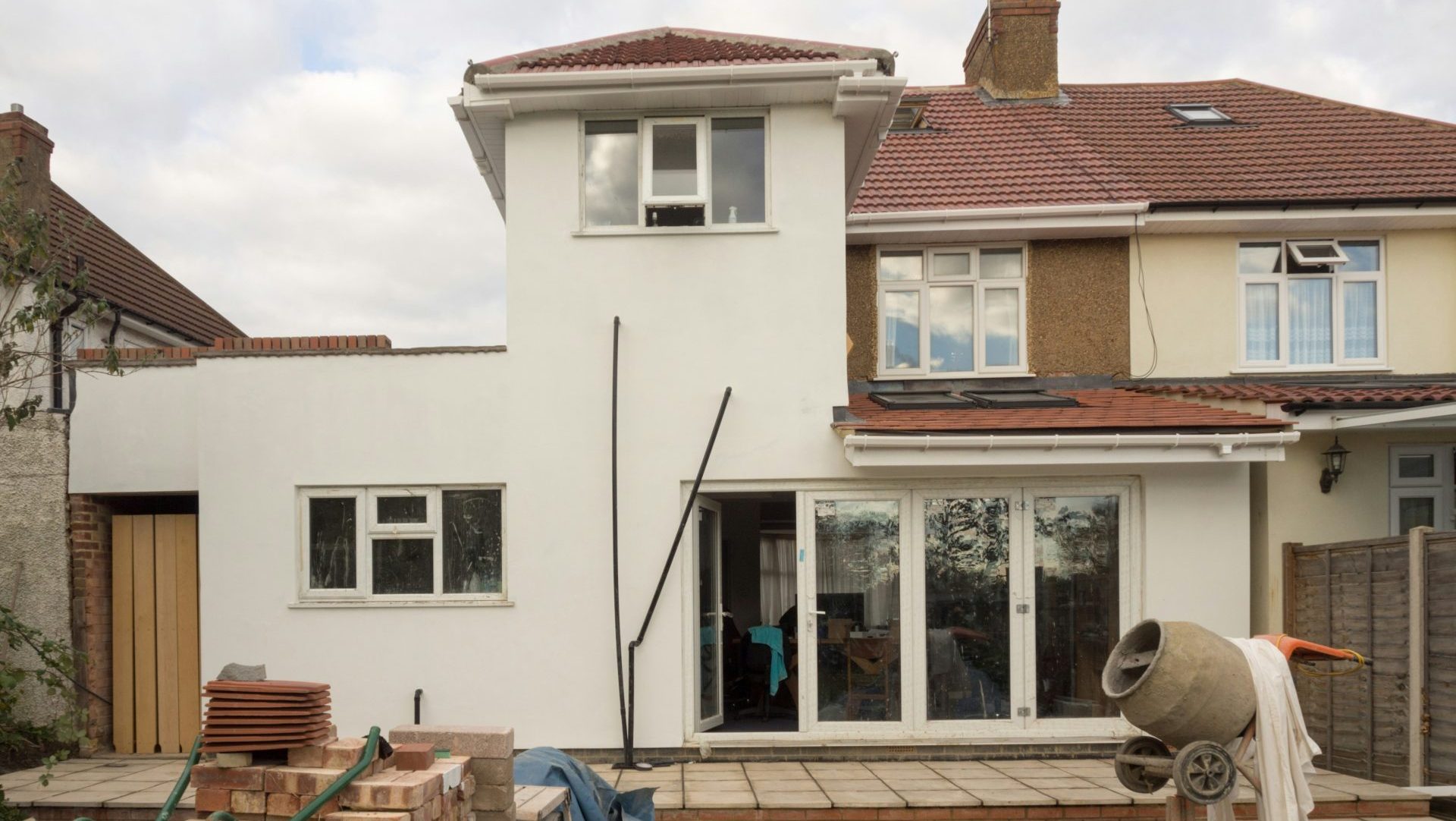 A house under construction is shown.